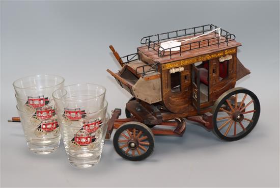 A Wells Fargo & Co model stagecoach, six glasses, a money clip, a brush and a letter